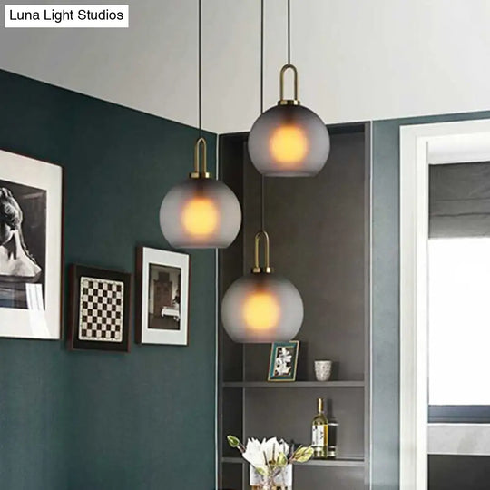 Modern Glass Sphere Pendant Light With Smoky Grey Frosted Finish Single-Bulb Brass Ceiling Hanging