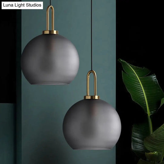 Modern Glass Sphere Pendant Light With Smoky Grey Frosted Finish Single-Bulb Brass Ceiling Hanging