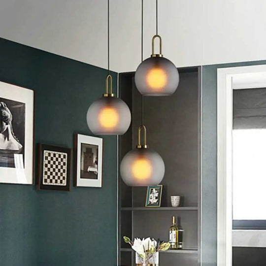 Frosted Smoky Grey Glass Sphere Pendant With Brass Ceiling Hang Light - Modern Single-Bulb Various