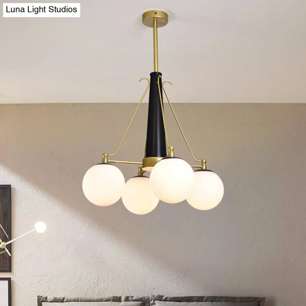 Modern Frosted White Glass Pendant Chandelier With 4 Brass And Black Hanging Heads