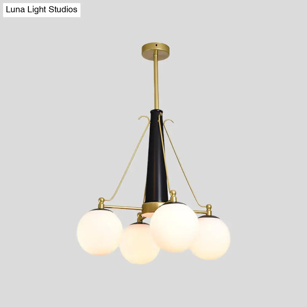 Modern Frosted White Glass Pendant Chandelier With 4 Brass And Black Hanging Heads