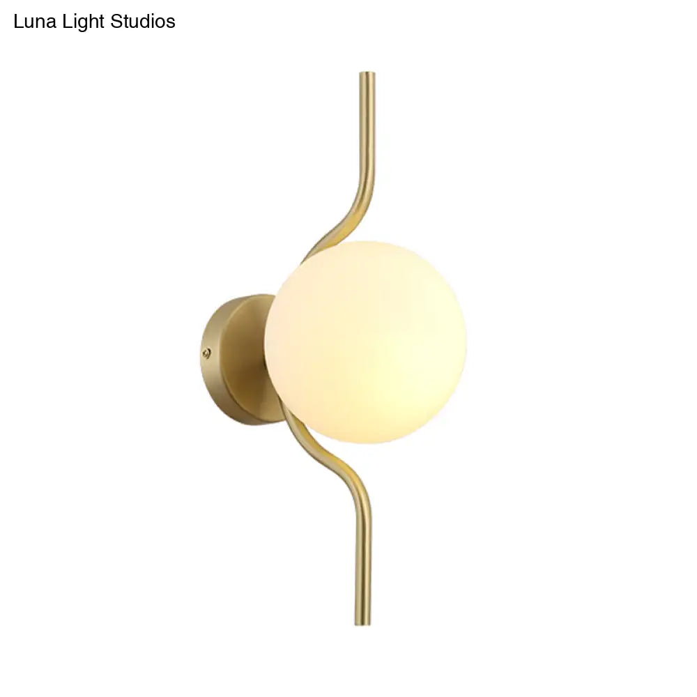 Globe White Glass Wall Mount Sconce Light With Elegant Gold Arm And Base