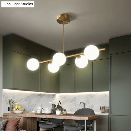 Gold Linear Island Pendant Light With Spherical Glass Shade - Perfect For Dining Table And