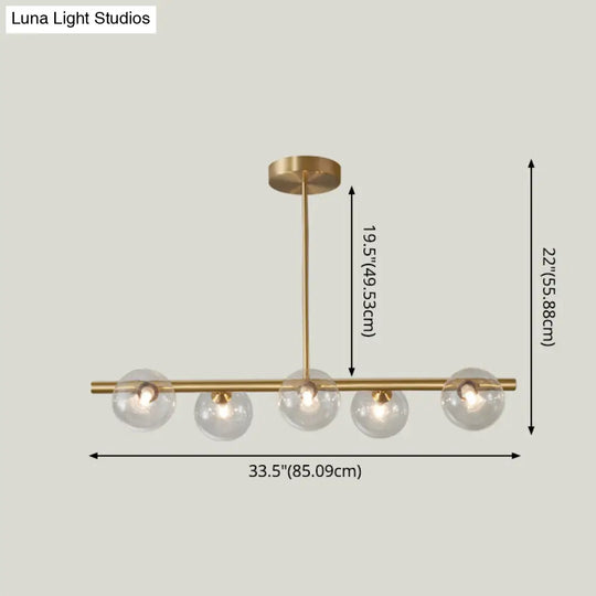 Linear Gold Pendant Light With Spherical Glass For Modern Minimalist Dining Table