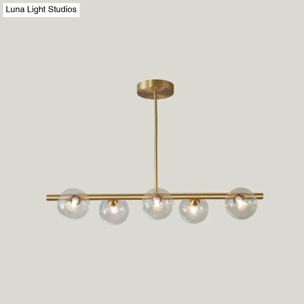 Linear Gold Pendant Light With Spherical Glass For Modern Minimalist Dining Table 5 / Clear