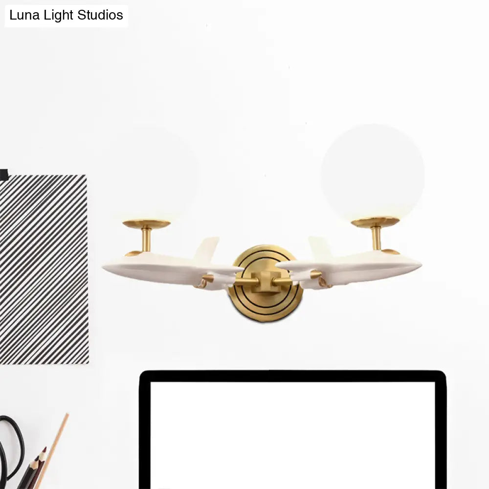 Gold Spaceship Wall Sconce With Cream Glass Globe For Kids Room - 1/2 Bulb Fixture In White &