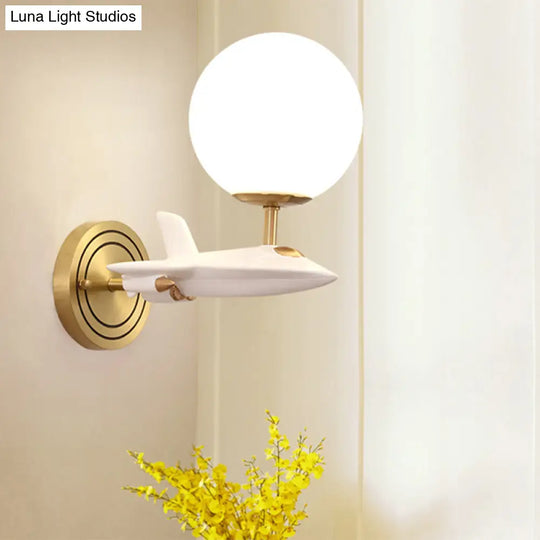 Gold Spaceship Wall Sconce With Cream Glass Globe For Kids Room - 1/2 Bulb Fixture In White &