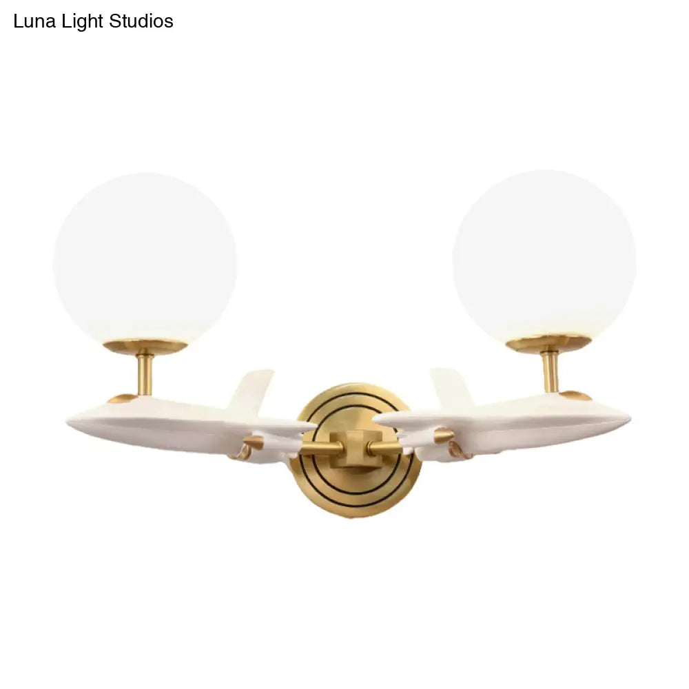 Gold Spaceship Wall Sconce With Cream Glass Globe For Kids Room - 1/2 Bulb Fixture In White &