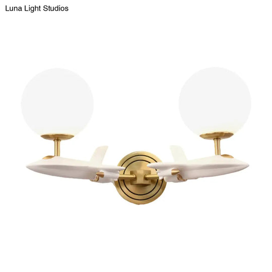 Gold Spaceship Wall Sconce With Cream Glass Globe For Kids Room - 1/2 Bulb Fixture In White &