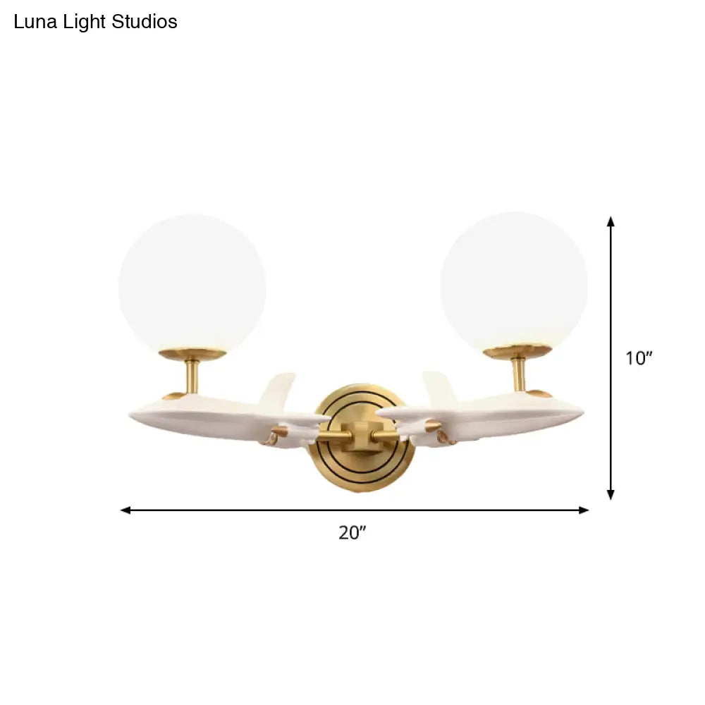 Gold Spaceship Wall Sconce With Cream Glass Globe For Kids Room - 1/2 Bulb Fixture In White &