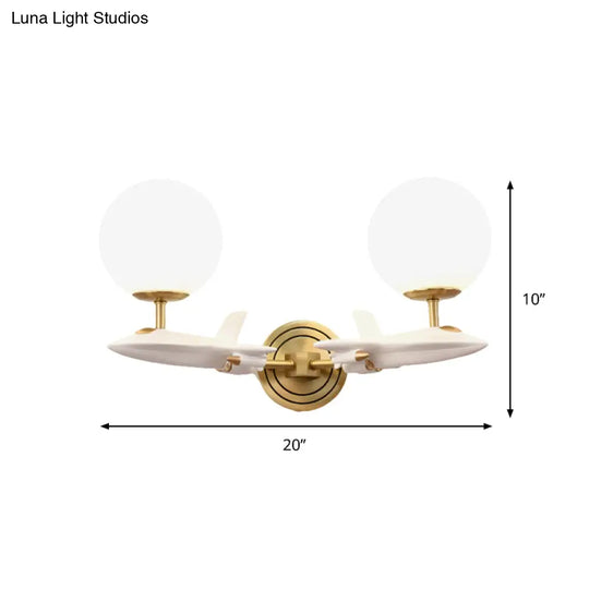 Gold Spaceship Wall Sconce With Cream Glass Globe For Kids Room - 1/2 Bulb Fixture In White &