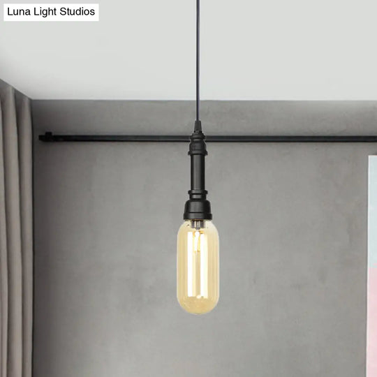Industrial Black Finish Amber Glass Pendant Lamp With Pipe Suspension - 1-Light Ball/Capsule