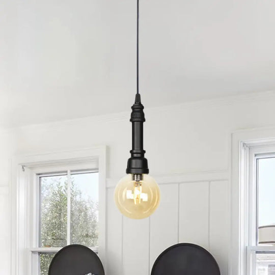 Industrial Black Finish Amber Glass Pendant Lamp With Pipe Suspension - 1-Light Ball/Capsule