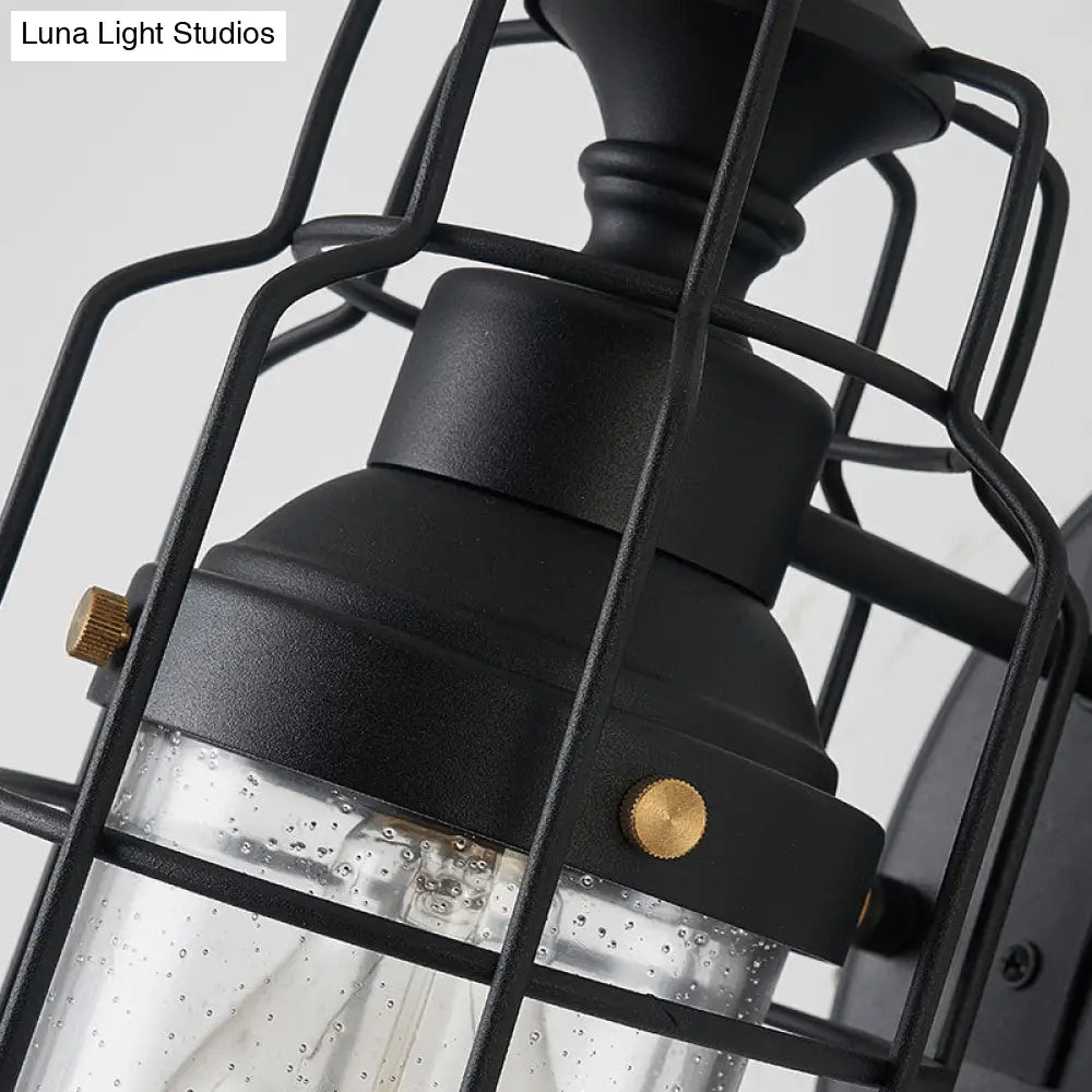 Industrial Black Seedy Glass Wall Sconce With Metal Cage Frame And Bell Shade For Corridor Lighting