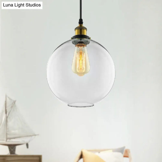 Industrial Globe Clear Glass Pendant Light With Antique Brass Finish - 1-Light Hanging Kit