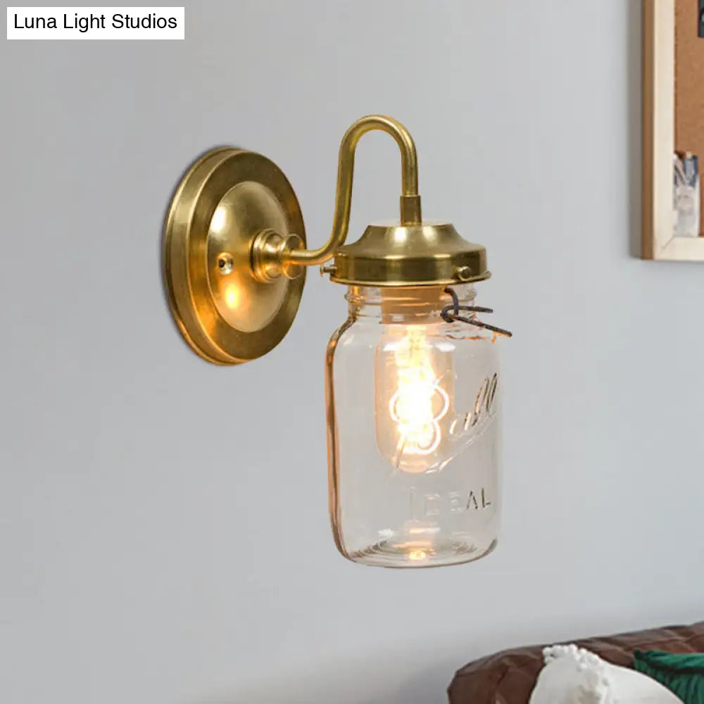 Industrial Clear Glass Wall Sconce With Brass Finish And Letter Detail