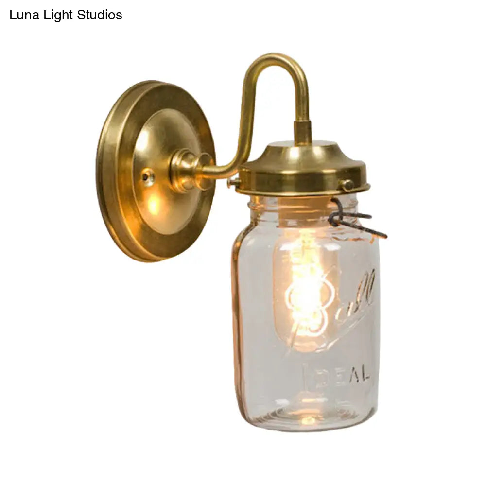 Industrial Clear Glass Wall Sconce With Brass Finish And Letter Detail