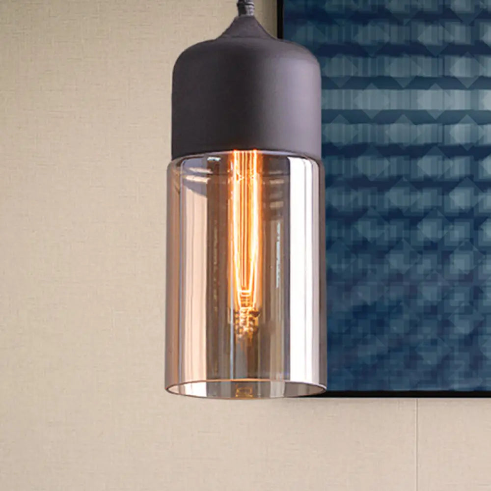 Industrial Cylinder Pendant Light With Brown Glass Shade - 1-Light Hanging Ceiling Fixture In Black