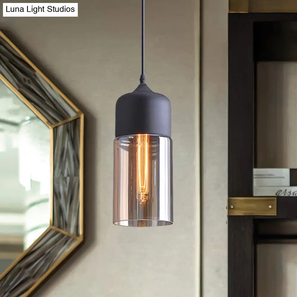 Industrial Cylinder Pendant Light With Brown Glass Shade - 1-Light Hanging Ceiling Fixture In Black
