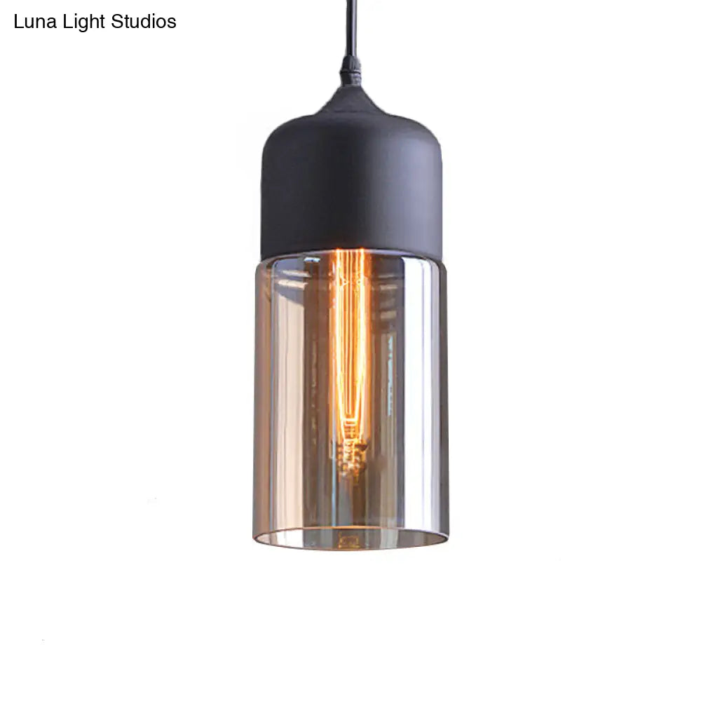 Industrial Cylinder Pendant Light With Brown Glass Shade - 1-Light Hanging Ceiling Fixture In Black