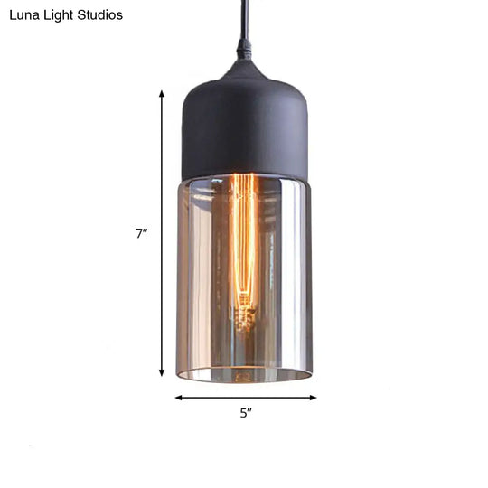 Industrial Cylinder Pendant Light With Brown Glass Shade - 1-Light Hanging Ceiling Fixture In Black