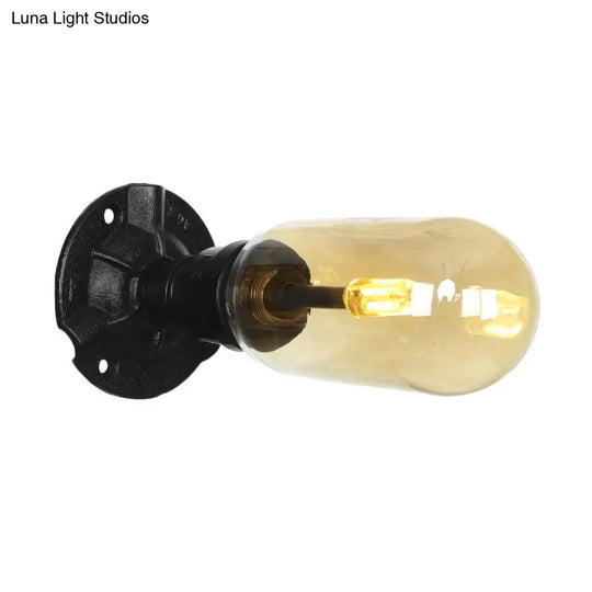 Industrial Dining Room Wall Sconce Lighting Fixture In Black - Amber Glass Capsule With Pipe Design