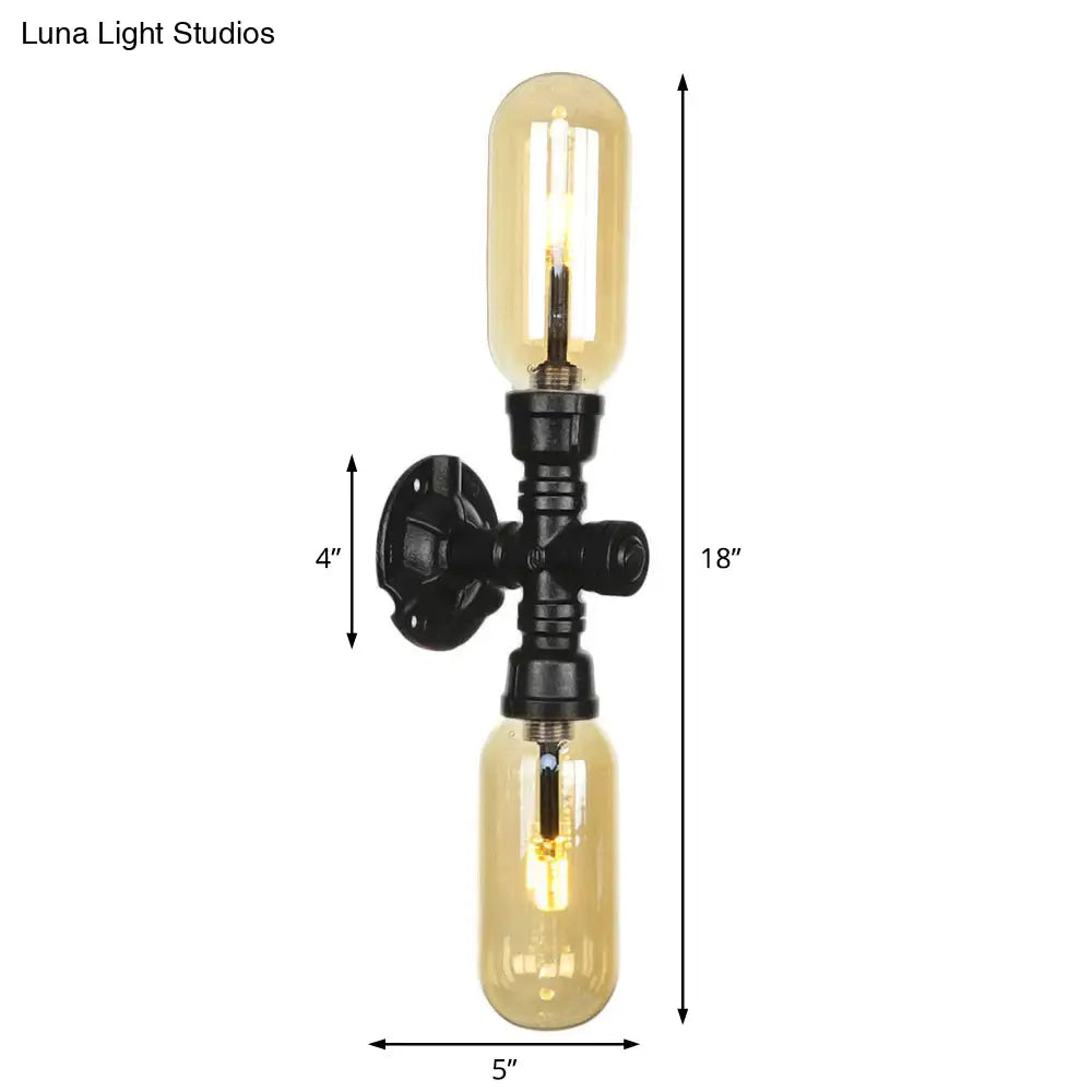 Industrial Dining Room Wall Sconce Lighting Fixture In Black - Amber Glass Capsule With Pipe Design