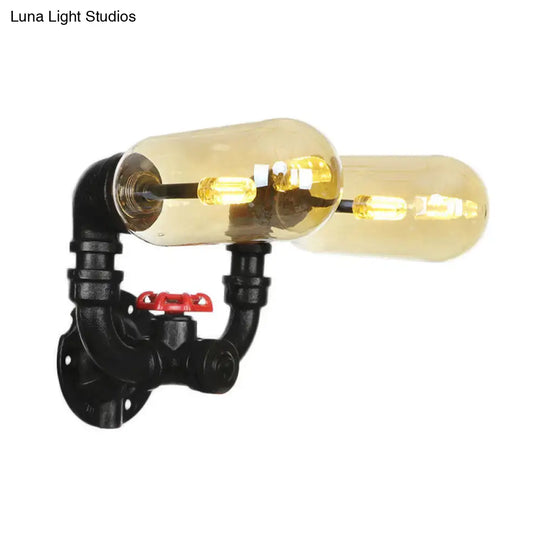 Industrial Dining Room Wall Sconce Lighting Fixture In Black - Amber Glass Capsule With Pipe Design