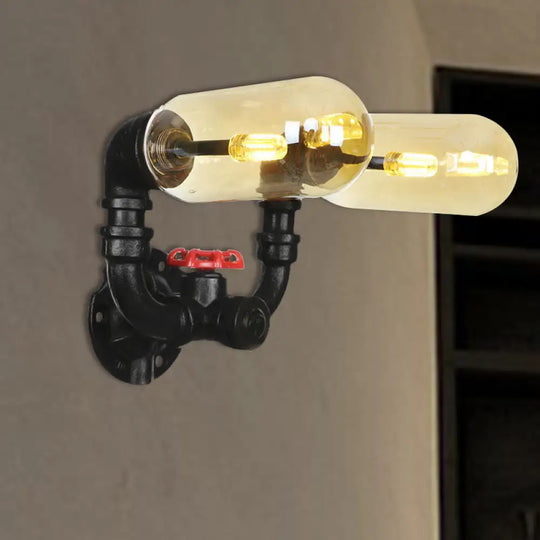 Industrial Dining Room Wall Sconce Lighting Fixture In Black - Amber Glass Capsule With Pipe Design