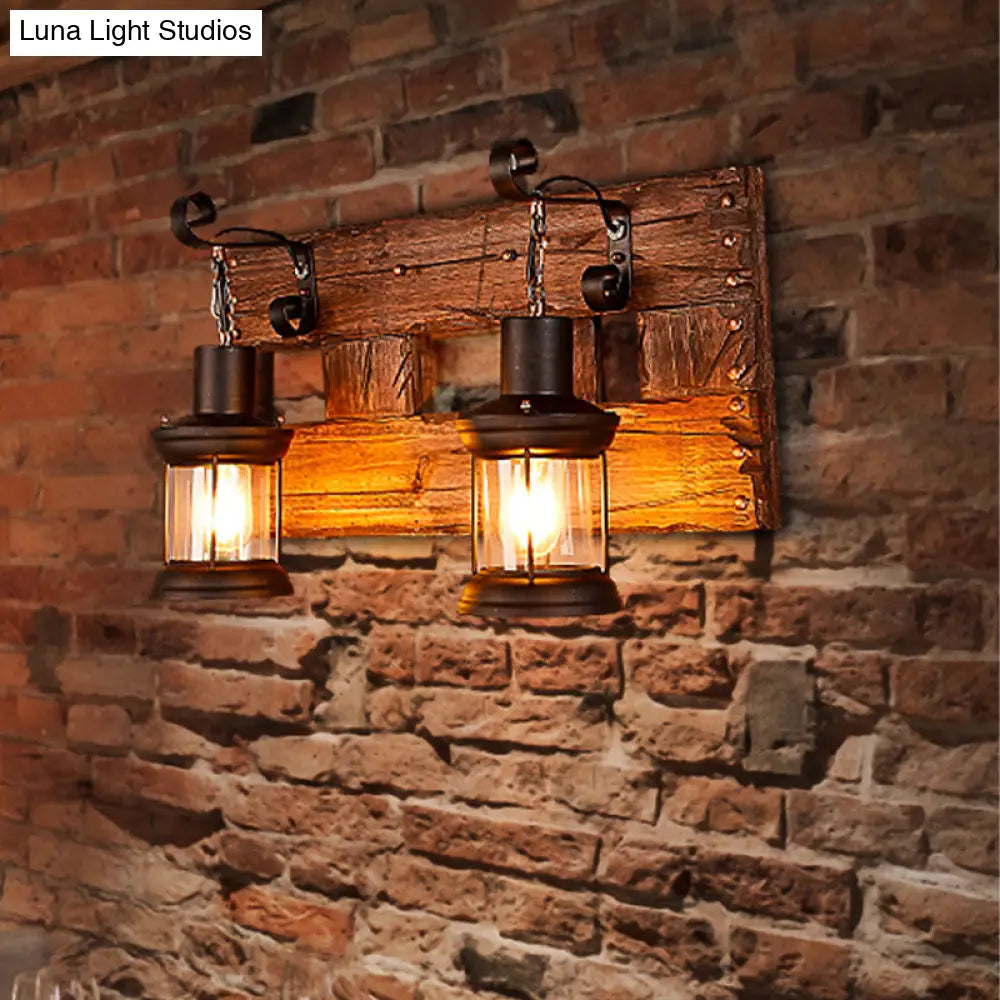 Industrial Lantern Wall Sconce - Clear Glass Black 2-Light Fixture With Wooden Backplate