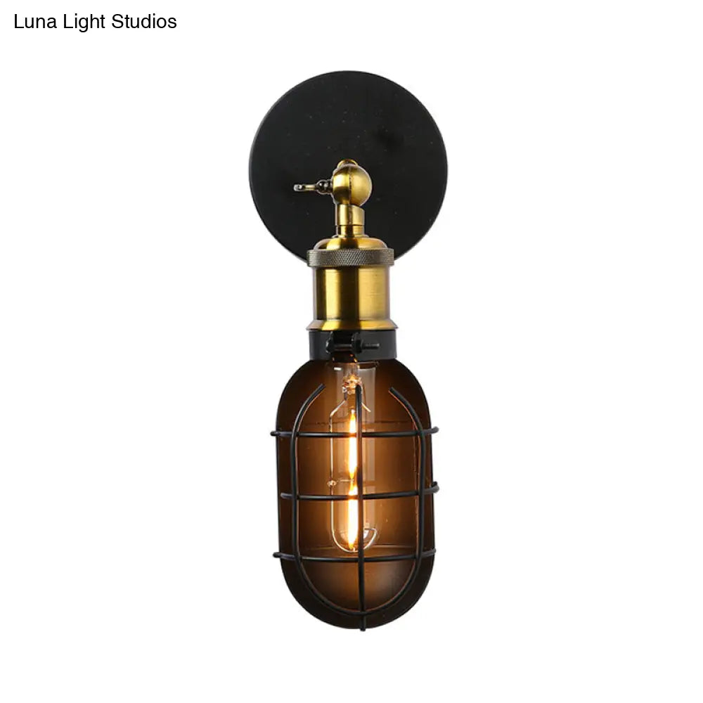 Industrial Metal Black And Brass Wall Lamp With Capsule Cage Design - 1 Head Sconce For Restaurant