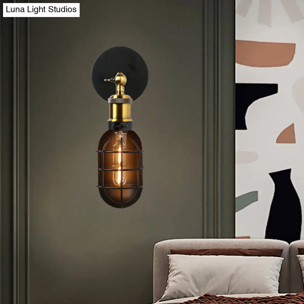 Industrial Metal Black And Brass Wall Lamp With Capsule Cage Design - 1 Head Sconce For Restaurant