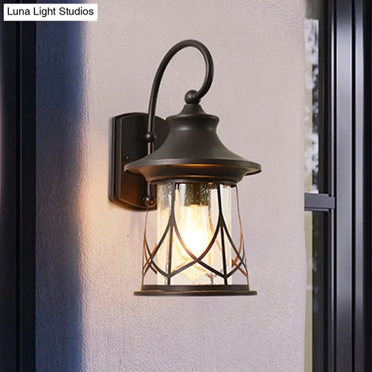 Industrial Porch Sconce With Seeded Glass Lantern Shade And One Bulb