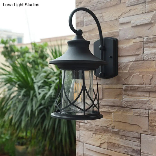 Industrial Porch Sconce With Seeded Glass Lantern Shade And One Bulb