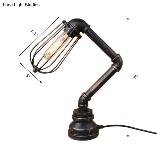 Industrial Style Metal Table Lamp With Bulb Cage Shade & Water Pipe In Aged Bronze