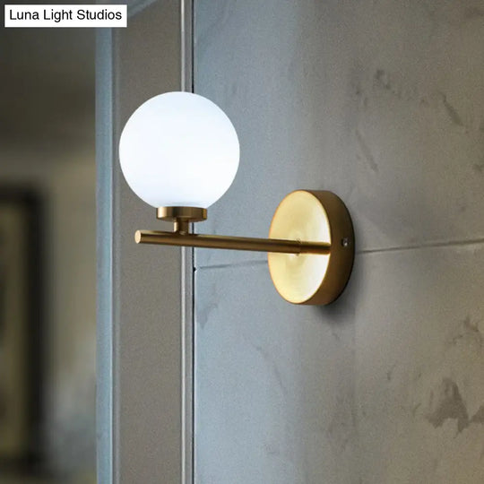 Ivory Glass Single Wall Sconce With Gold Finish For Bedroom - Simple And Elegant