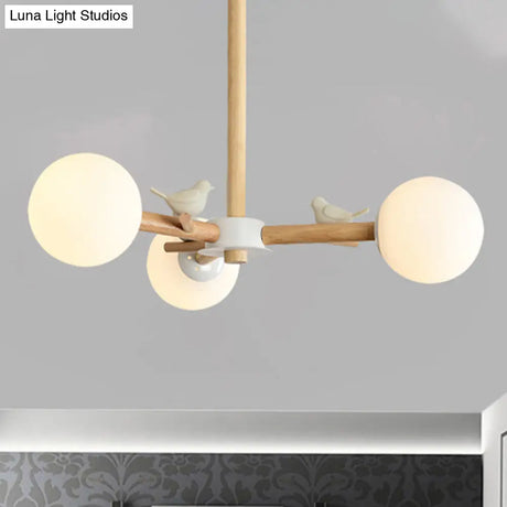Japanese-Inspired Bedroom Chandelier With Orb Shade Birds Wood And Glass In White