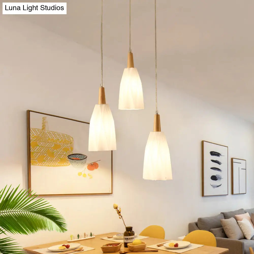 Japanese 3-Light Glass Pendant With Prismatic Cluster In White Hangs From Wood Canopy