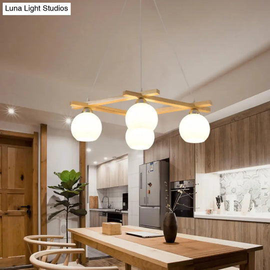 Japanese Style 4-Bulb Cream Glass Sphere Pendant Chandelier For Living Room In Wood