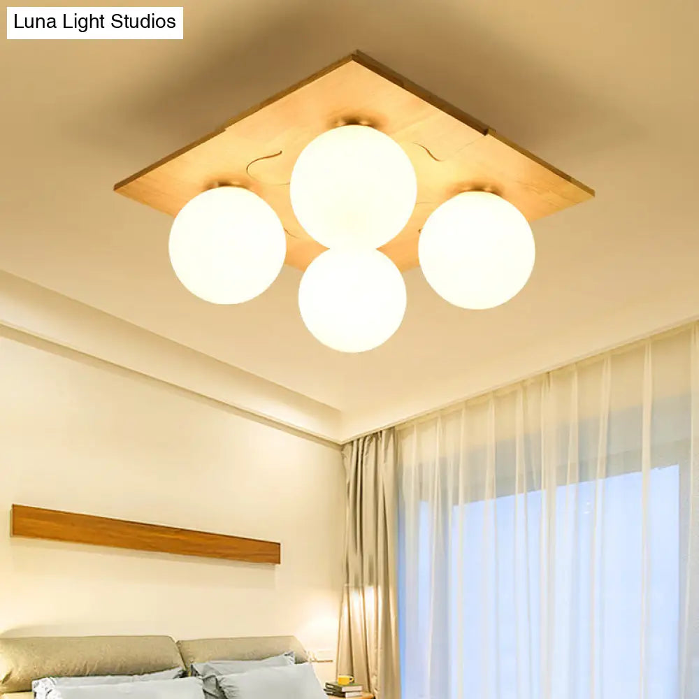 Japanese Style Round Flush Mount Ceiling Light Fixture With White Glass And Wooden Accent - 4 Bulb