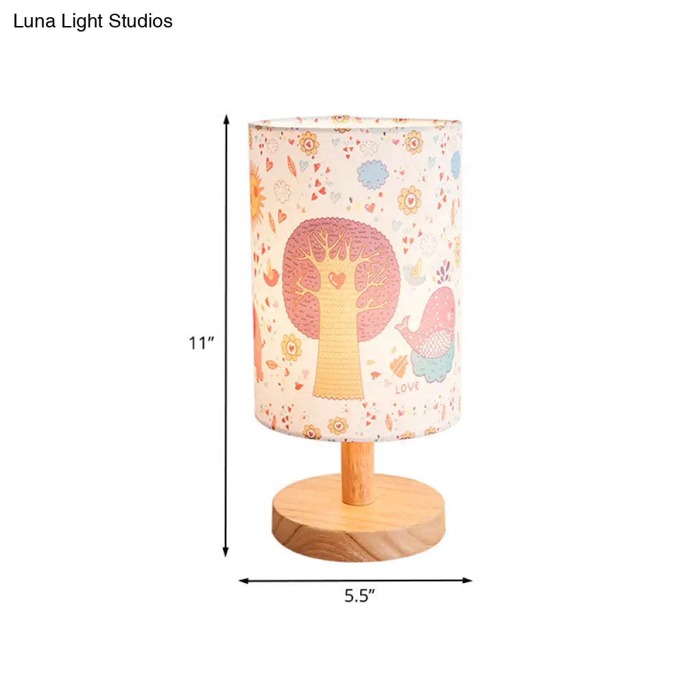 Kids Wood Cylinder Nightstand Lamp With Tree And Flower Pattern - Fabric Shade