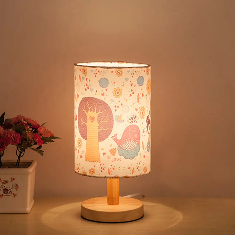 Kids Wood Cylinder Nightstand Lamp With Tree And Flower Pattern - Fabric Shade