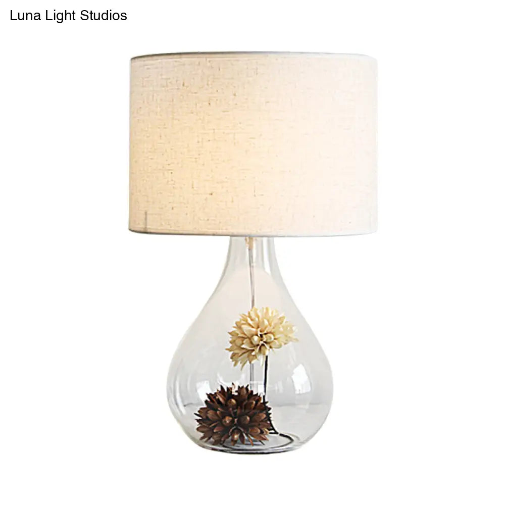 Pastoral Fabric 1-Light Table Lamp With White Drum Shade Vase Clear Glass Base & Dried Flower Accent