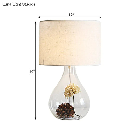 Pastoral Fabric 1-Light Table Lamp With White Drum Shade Vase Clear Glass Base & Dried Flower Accent