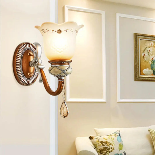 Lodge Style Flower Wall Lamp With Frosted Glass Teardrop Crystal Deco And Metal Arm In Gold -