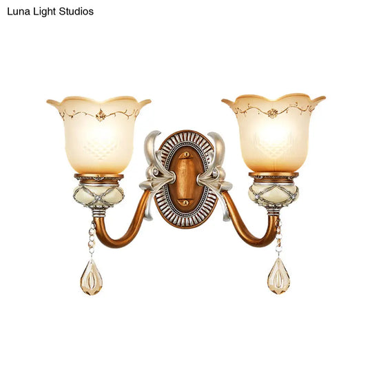 Lodge Style Flower Wall Lamp With Frosted Glass Teardrop Crystal Deco And Metal Arm In Gold -