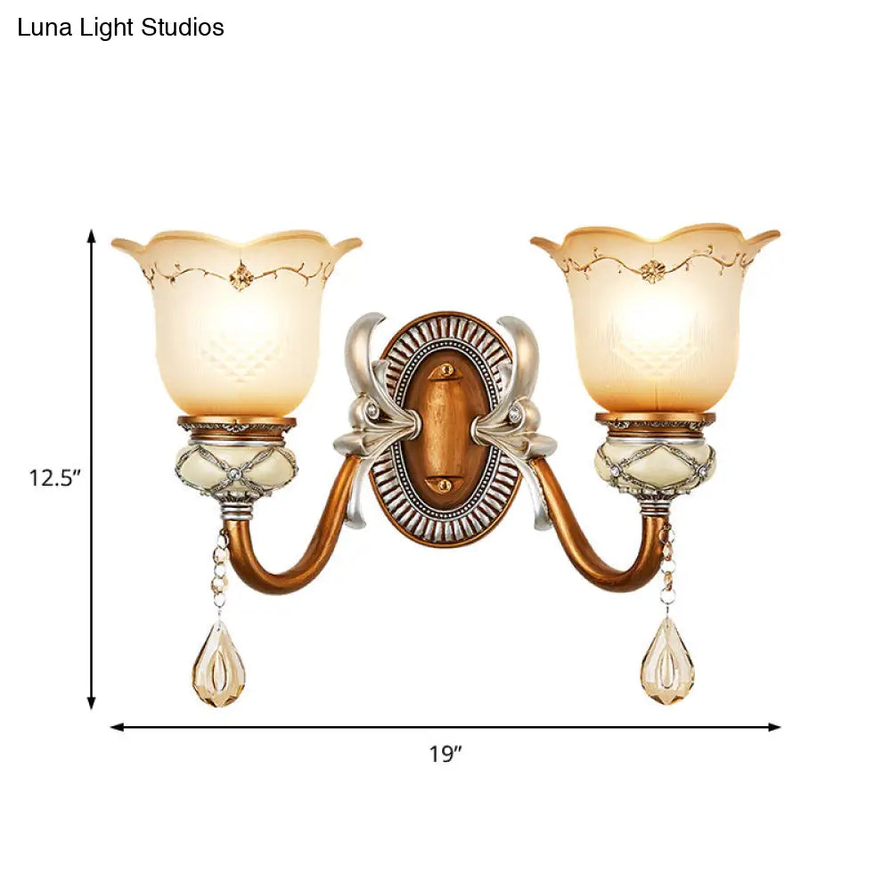 Lodge Style Flower Wall Lamp With Frosted Glass Teardrop Crystal Deco And Metal Arm In Gold -