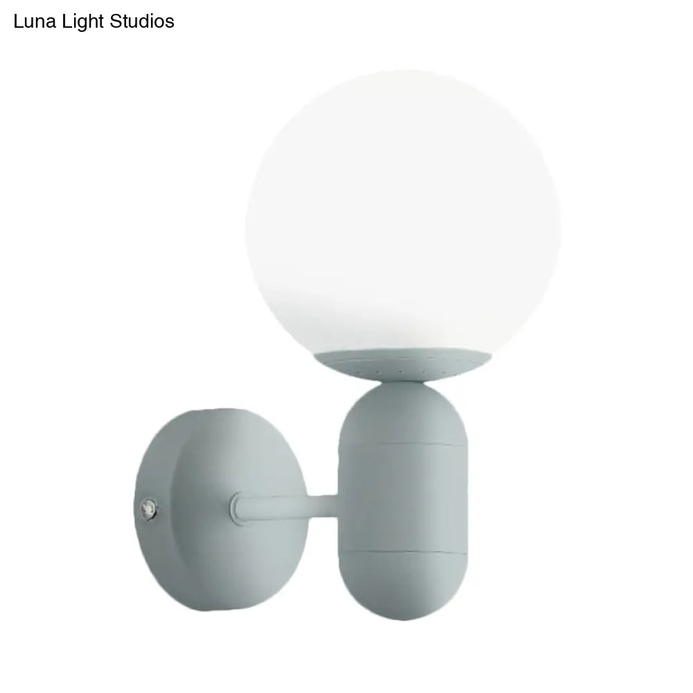 Metal Capsule Sconce Light With Globe Shade - Macaron Style Wall Lamp