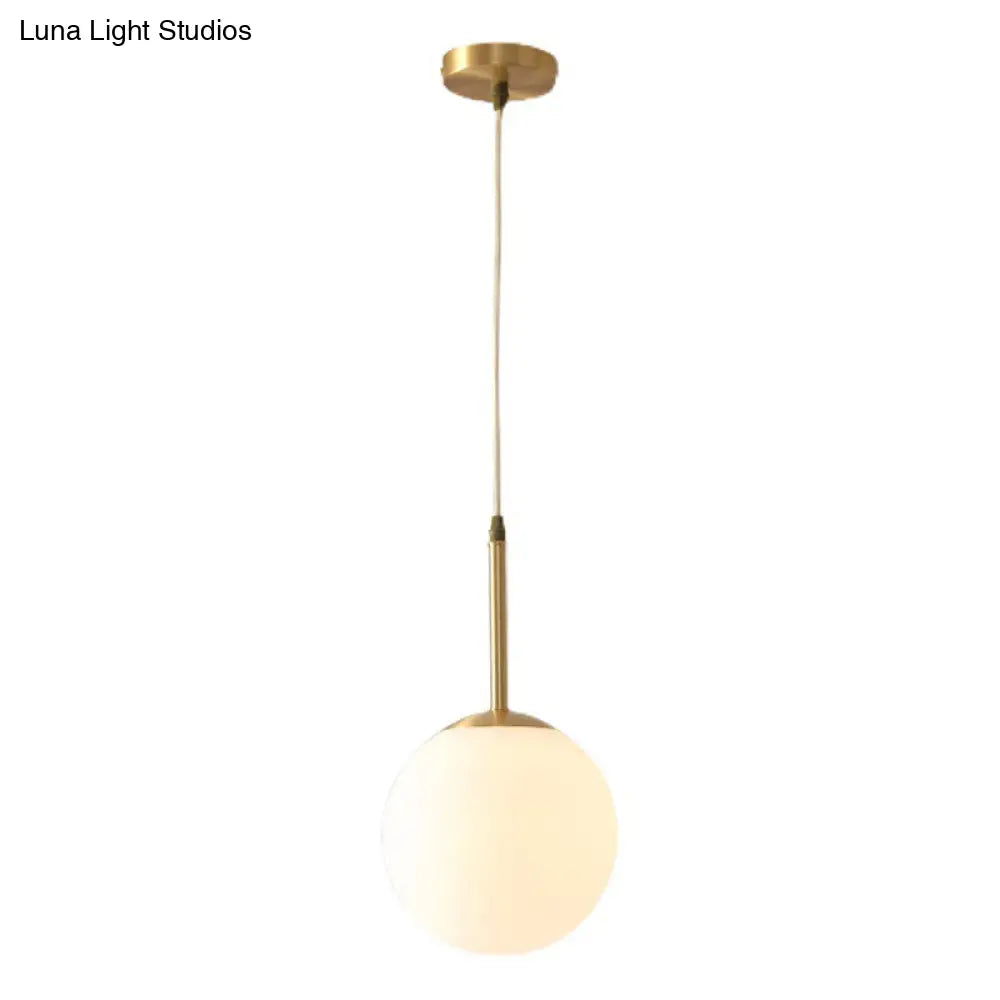 Mid-Century Modern Brass Pendant Light With Spherical White Glass Shade Gold