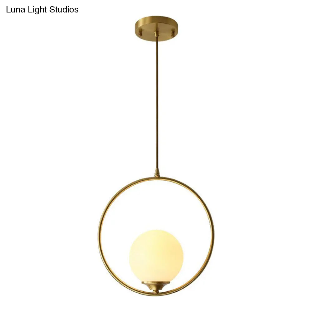 Minimalist Antique Gold Ball Ceiling Lamp With Cream Glass Shade And Ring Decoration